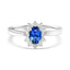 Oval cut blue sapphire and diamond halo ring in 18ct white gold