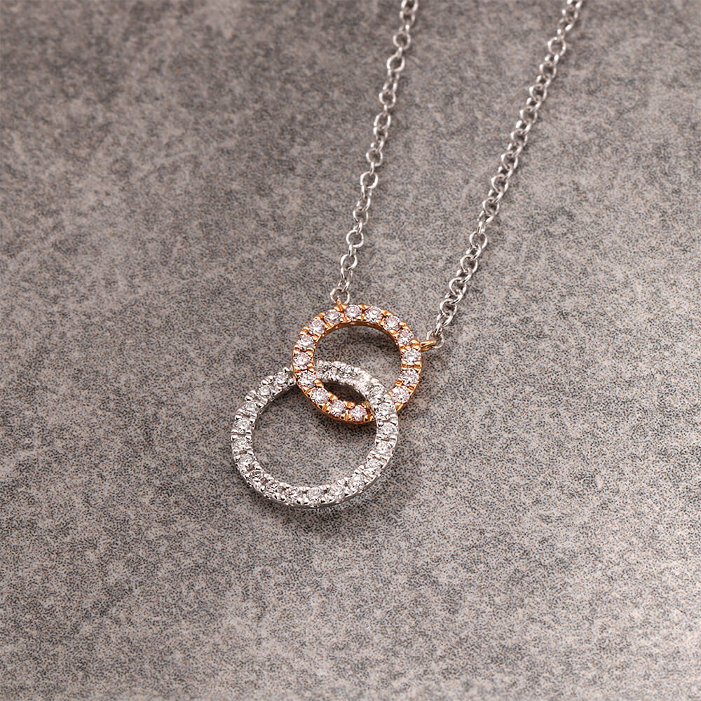 Pink diamond circle pendant.